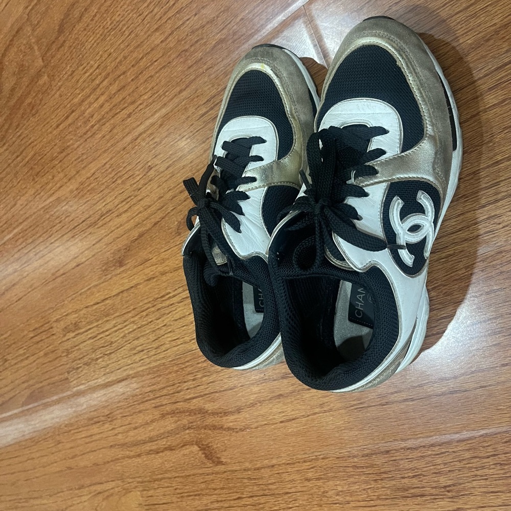 CHANEL Black, White, and Gold Athletic Shoes